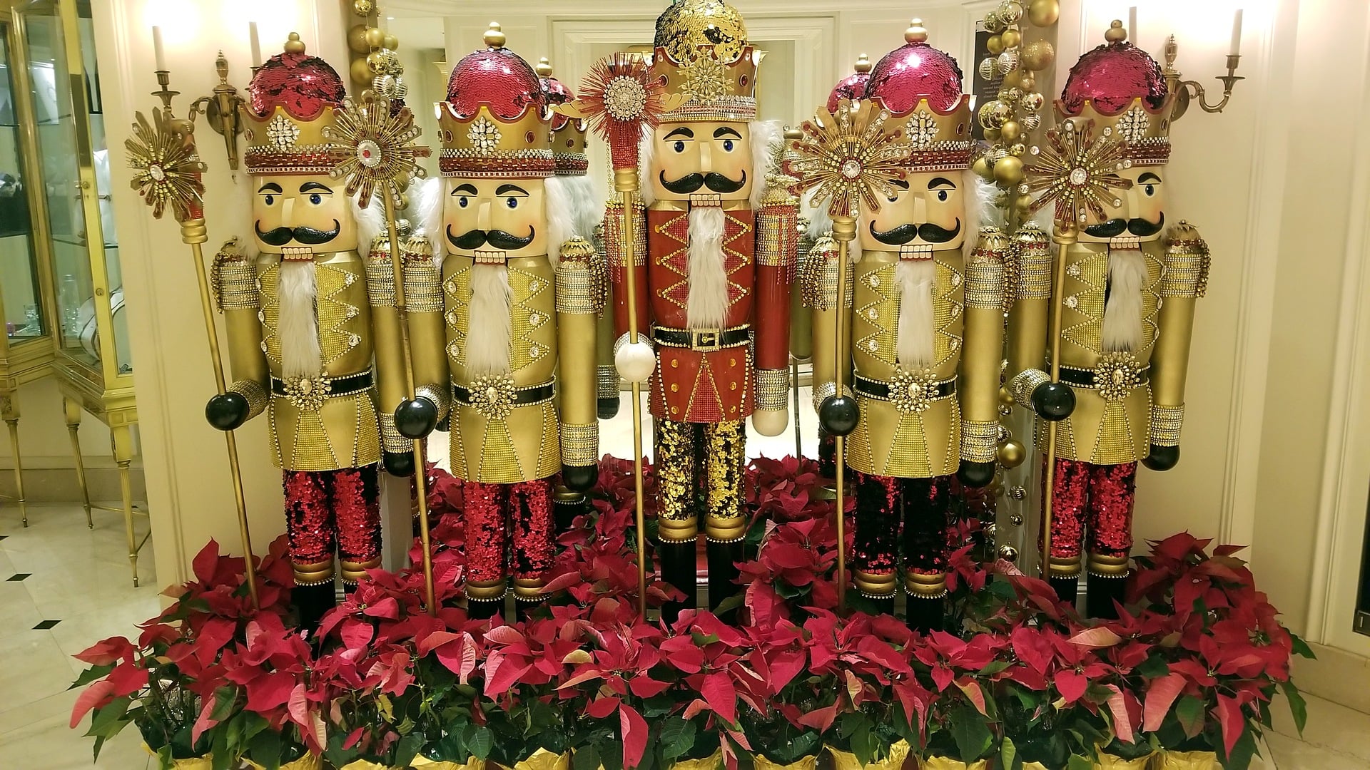 Life-size nutcrackers and red poinsettias in the lobby of the Beverly Wilshire in Beverly Hills