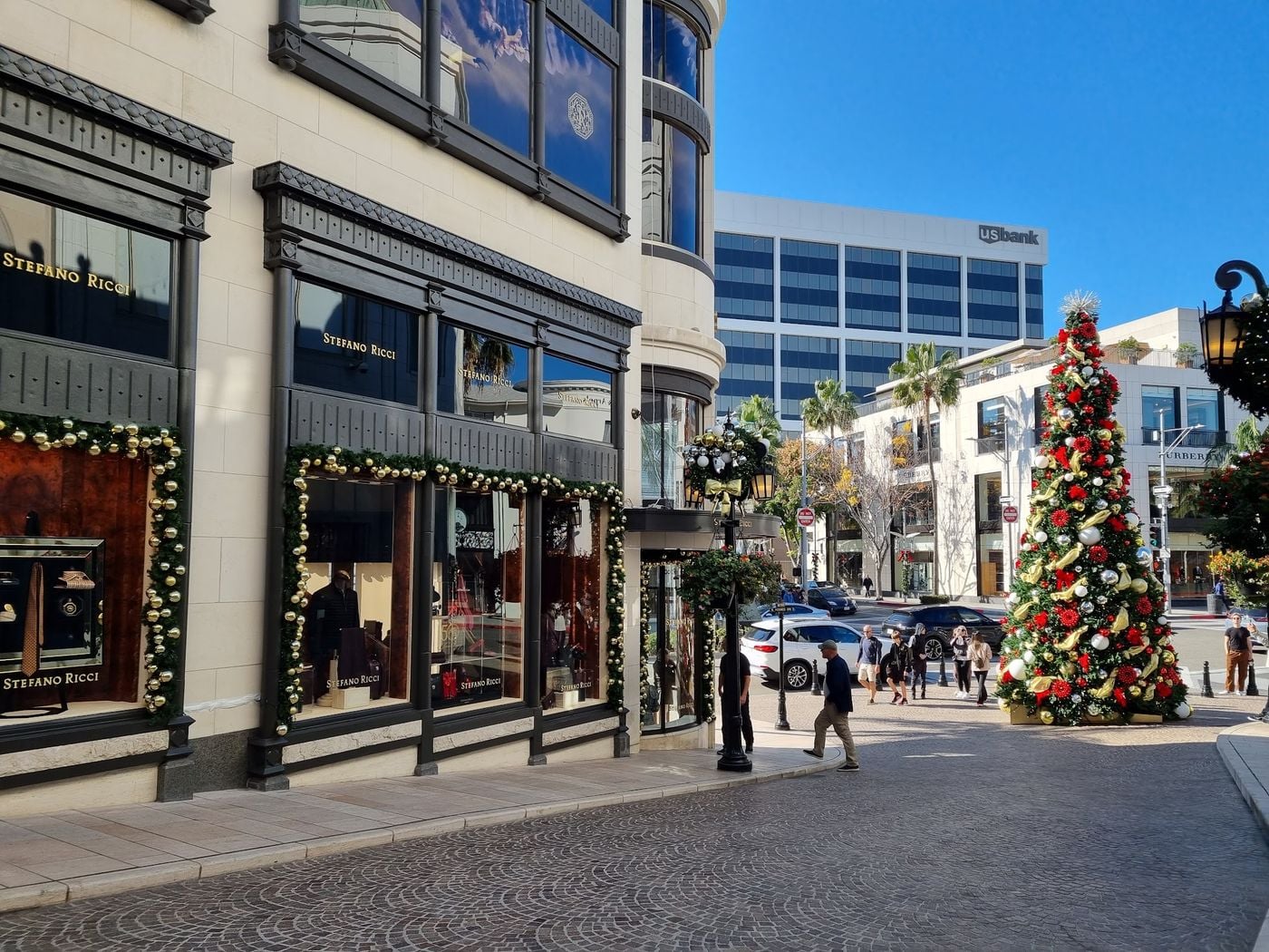 A decorated Christmas tree and wreath-trimmed storefronts at Two Rodeo on Rodeo Drive in Beverly Hills