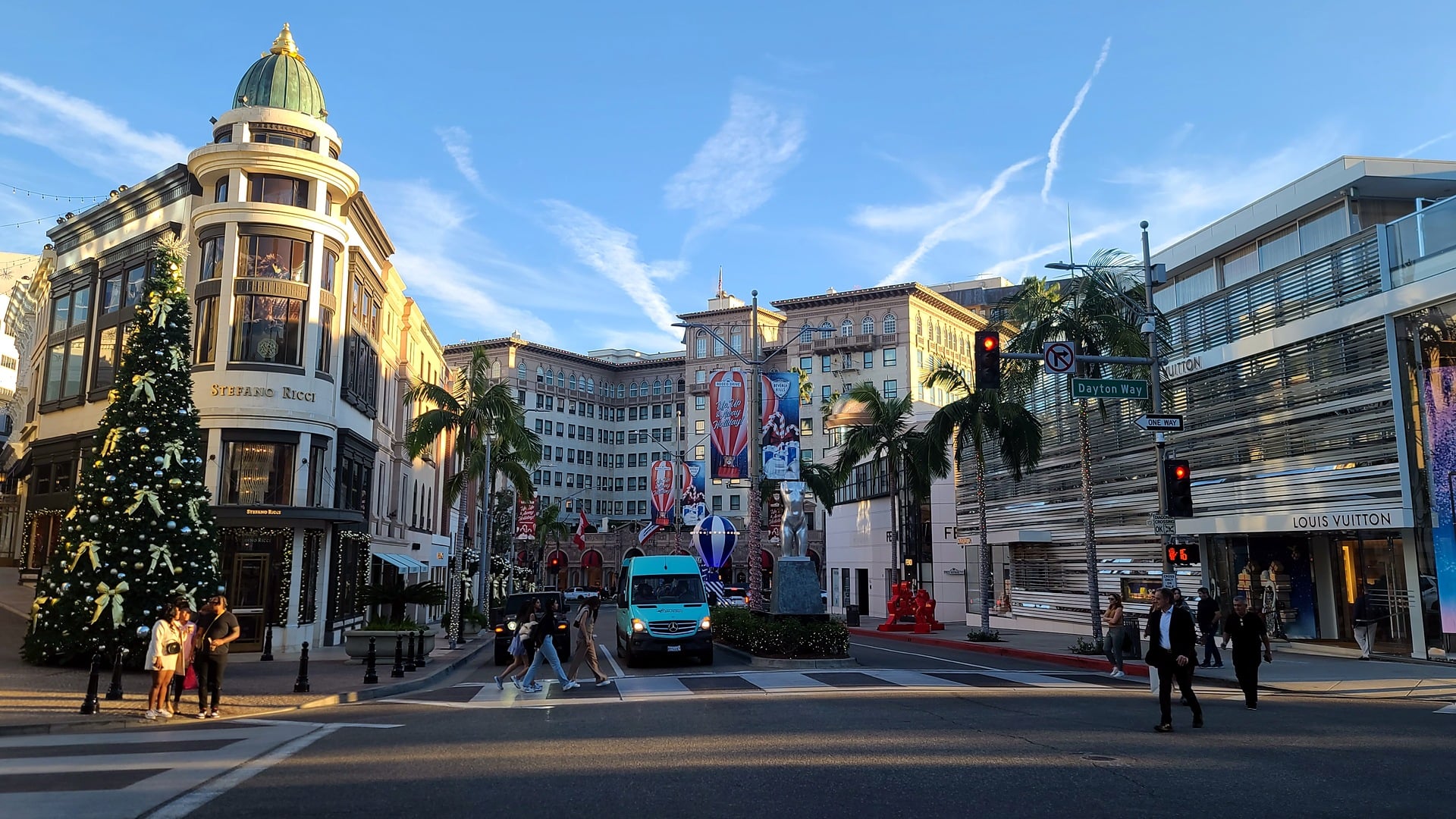 A decorated Christmas tree at the corner of Rodeo Drive and Wilshire Boulevard with Two Rodeo and the Beverly Wilshire behind it